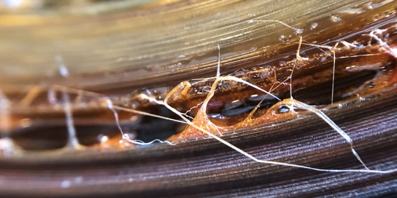 A photo of a badly deteriorated reel of nitrate film